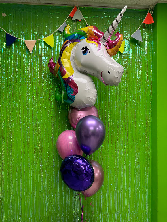Rainbow unicorn balloon bouquet with balloon base weight