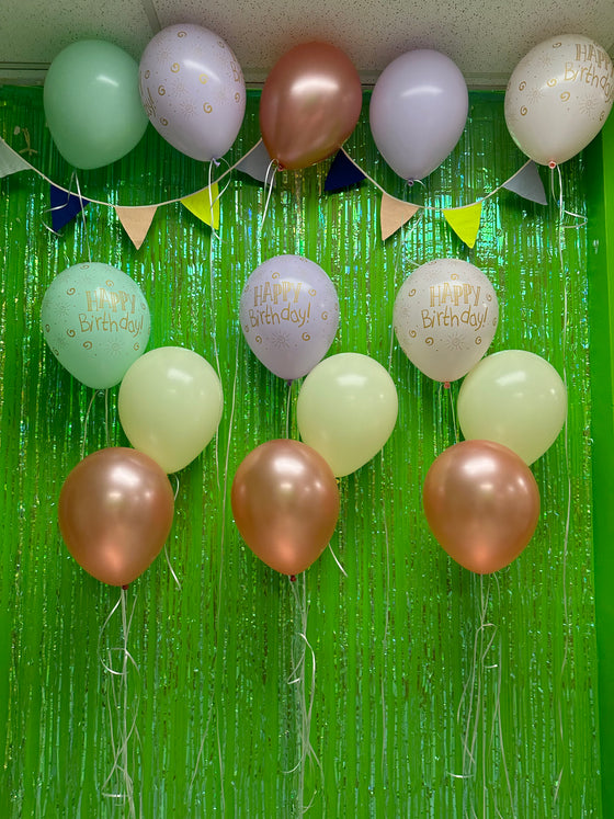 Pastel birthday balloon wall - 3 small bouquets and 5 loose balloons for the ceiling