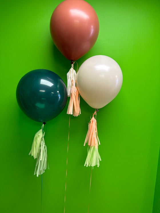 Helium inflated 18” latex balloons with tassels