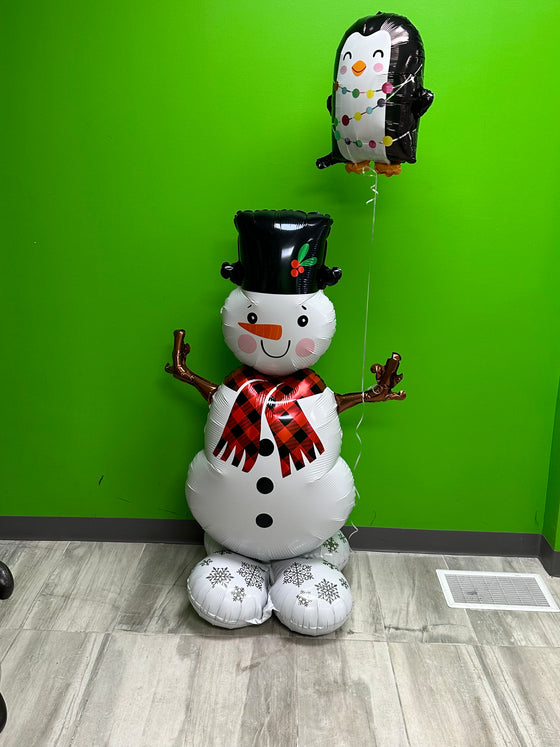 A snowman and his penguin