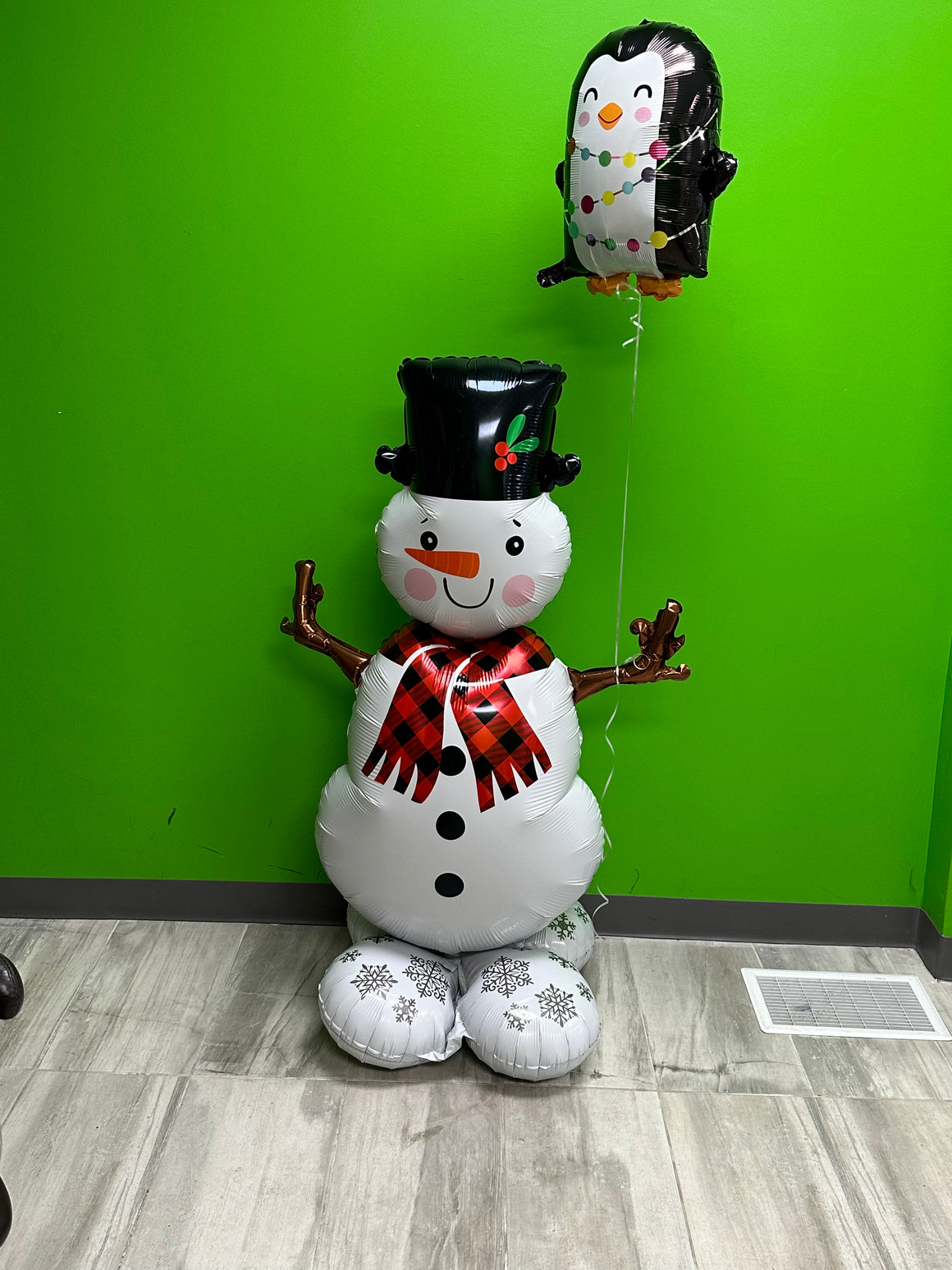 A snowman and his penguin